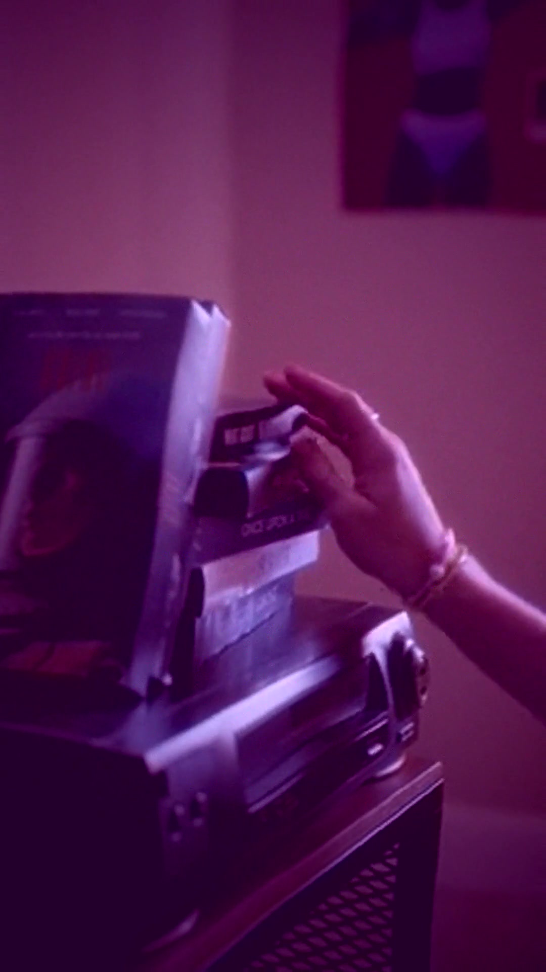 arcade-synthwave: VHS cassette + retro VCR in purple city-pop neon grade