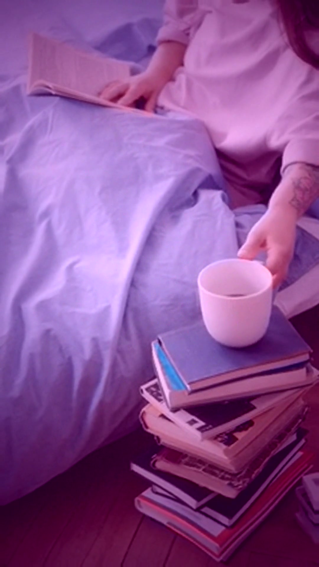 linen-minimal: bedroom bookstack and coffee mug, kr warm pastel grade