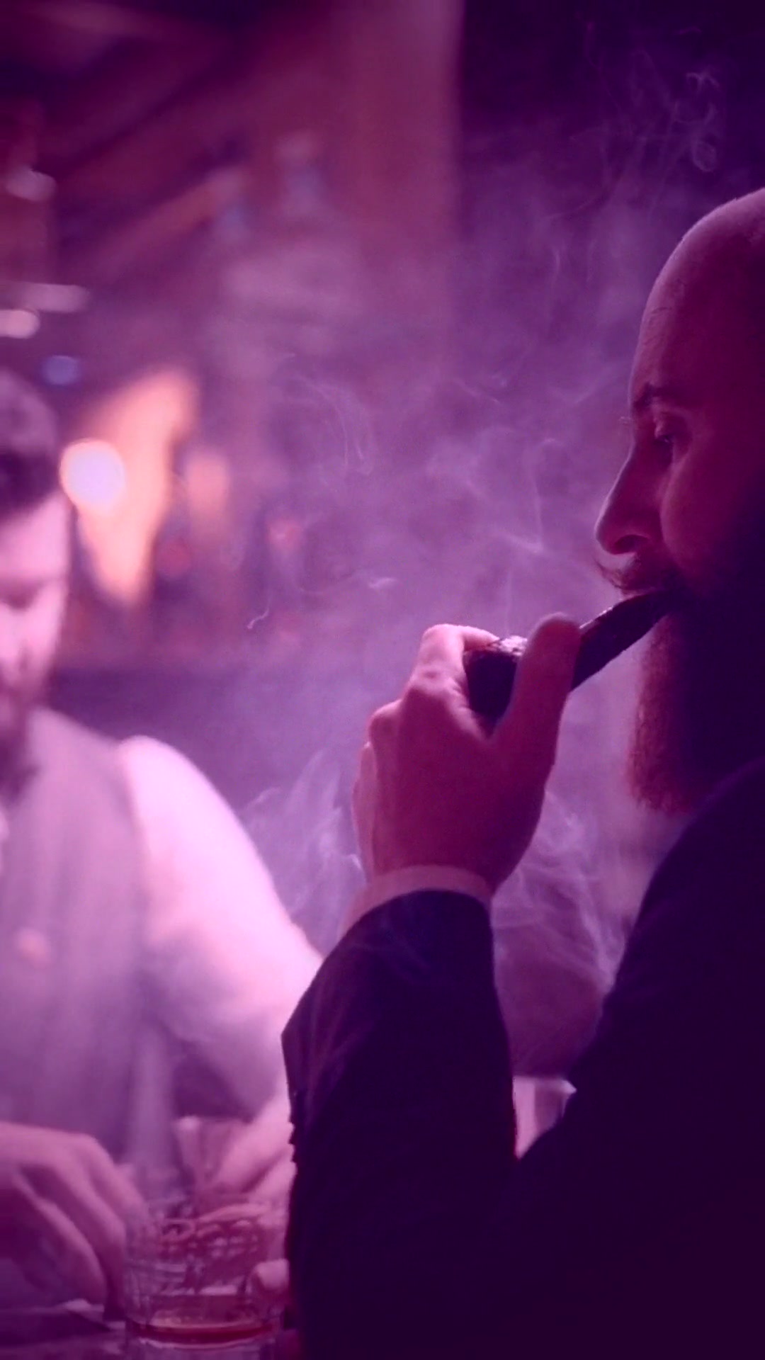 noir-detective: smoky bar interior, bearded man with pipe, pink-magenta low-key grade