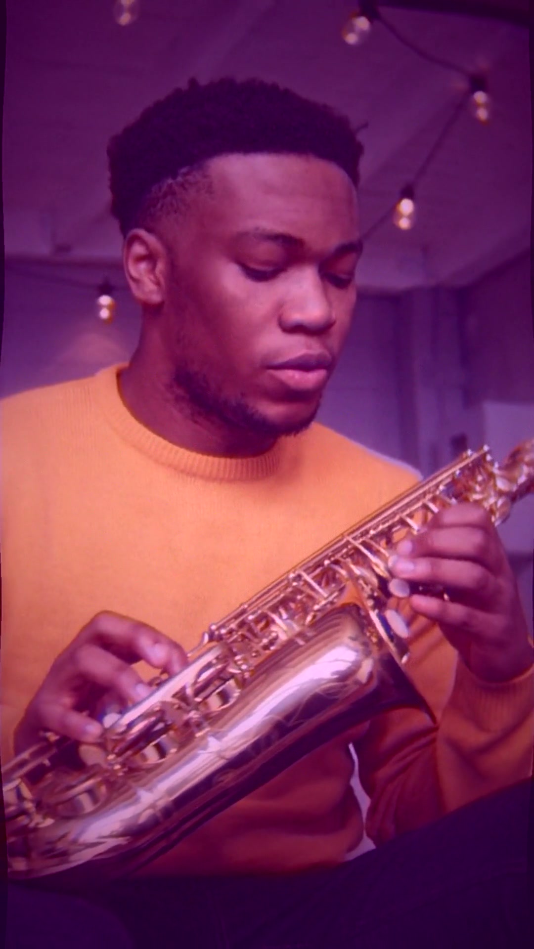 Mid-climax frame from the first uploaded music-video short — 9:16 vertical, vintage jazz interior with amber lamp, vinyl record motif, warm halation bloom around bright sources and subtle pond-surface ripple displacement across the whole frame, Pexels-licensed B-roll under a Suno-generated lo-fi jazz track.